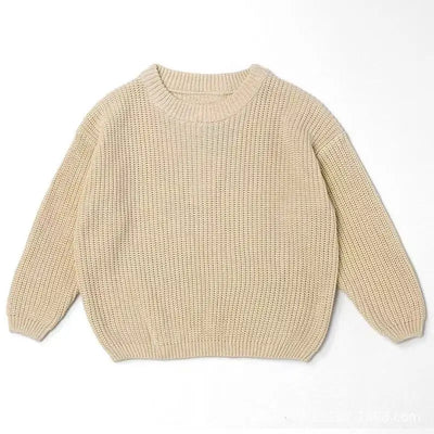 Beige knitted sweater on a white background