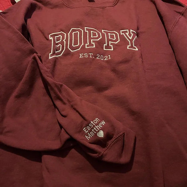 Maroon sweatshirt with 'BOPPY EST. 2021' text on a red background